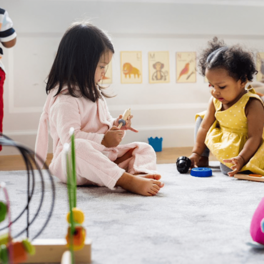 two pre-k students playing.